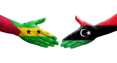 Libya ve Sao Tome ve Principe bayrakları arasındaki el sıkışma, izole şeffaf görüntü.