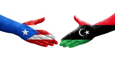 Libya ve Porto Riko bayrakları arasındaki el sıkışma ellerinde resmedilmiş şeffaf görüntü.