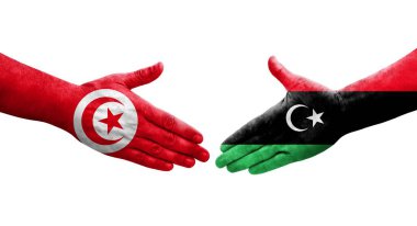 Libya ve Tunus bayrakları arasındaki el sıkışma, izole edilmiş şeffaf görüntü.