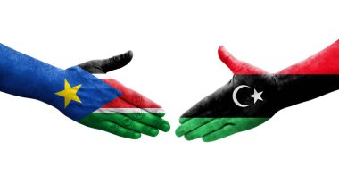 Libya ile Güney Sudan bayrakları arasındaki el sıkışma, izole saydam görüntü.