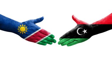 Libya ve Namibya bayrakları arasındaki el sıkışma, izole edilmiş şeffaf görüntü.