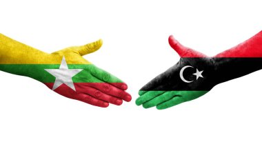 Libya ve Myanmar bayrakları arasındaki el sıkışma, izole edilmiş şeffaf görüntü.