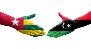 Libya ve Togo bayrakları arasındaki el sıkışma, izole edilmiş şeffaf görüntü.