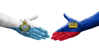 Lihtenştayn ve San Marino bayrakları arasındaki el sıkışma, izole şeffaf görüntü.