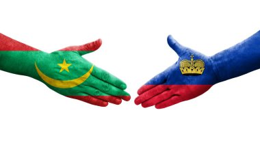Ellerinde Lihtenştayn ve Moritanya bayrakları arasında el sıkışma, izole şeffaf görüntü.