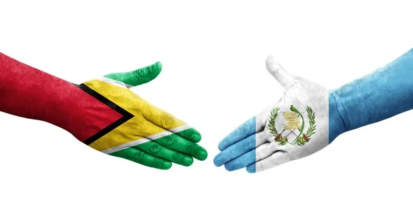 Händedruck Zwischen Guatemala Und Guyana Flaggen Auf Hände Gemalt Isoliertes — Stockfoto