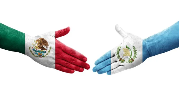 手に描かれたグアテマラとメキシコの旗の間の握手 孤立した透明なイメージ — ストック写真