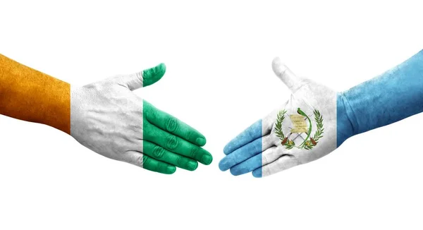 Händedruck Zwischen Flaggen Guatemalas Und Der Elfenbeinküste Auf Hände Gemalt — Stockfoto
