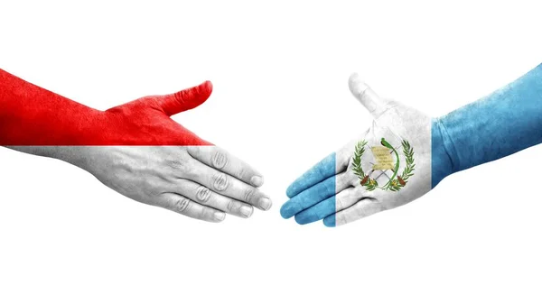 Händedruck Zwischen Flaggen Guatemalas Und Indonesiens Auf Hände Gemalt Isoliertes — Stockfoto