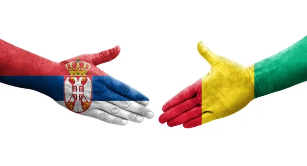 Рукостискання Між Гвінеєю Сербією Прапори Намальовані Руках Ізольоване Прозоре Зображення — стокове фото