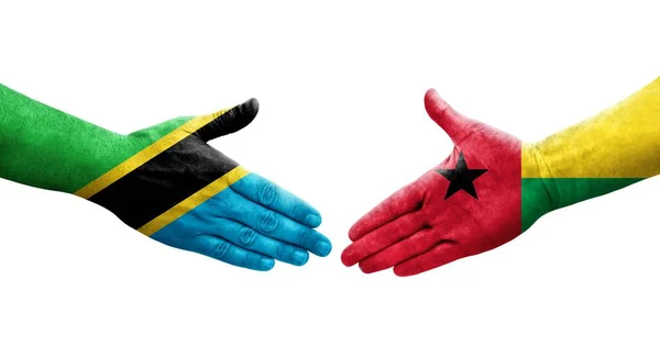 Рукопожатие Между Флагом Гвинеи Бисау Флагом Танзании Нарисованное Руках Изолированное — стоковое фото