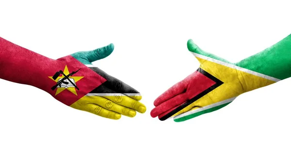 Guyana Mozambik Bayrakları Arasındaki Sıkışma Ellerinde Izole Şeffaf Görüntü — Stok fotoğraf