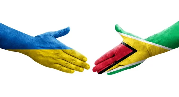 圭亚那和乌克兰之间握手 手绘国旗 孤立透明的图像 — 图库照片