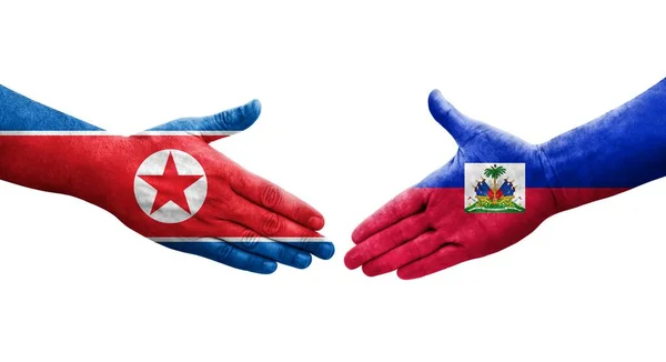 Aperto Mão Entre Haiti Coreia Norte Bandeiras Pintadas Mãos Imagem — Fotografia de Stock