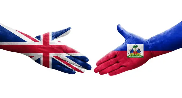 Handdruk Tussen Haïti Het Verenigd Koninkrijk Vlaggen Geschilderd Handen Geïsoleerd — Stockfoto