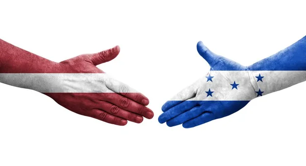 Händedruck Zwischen Honduras Und Lettland Fahnen Auf Hände Gemalt Isoliertes — Stockfoto