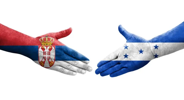 Händedruck Zwischen Honduras Und Serbien Fahnen Auf Hände Gemalt Isoliertes — Stockfoto