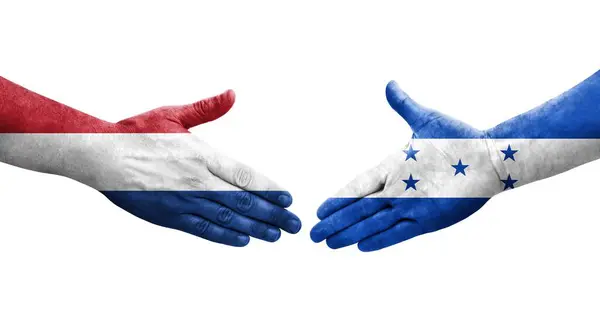 Рукостискання Між Гондурасом Прапорами Нідерландів Намальоване Руках Ізольоване Прозоре Зображення — стокове фото