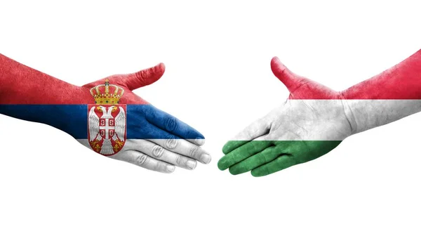 Mano Apretada Entre Las Banderas Hungría Serbia Pintadas Las Manos — Foto de Stock