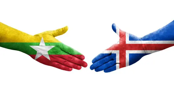 stock image Handshake between Iceland and Myanmar flags painted on hands, isolated transparent image.