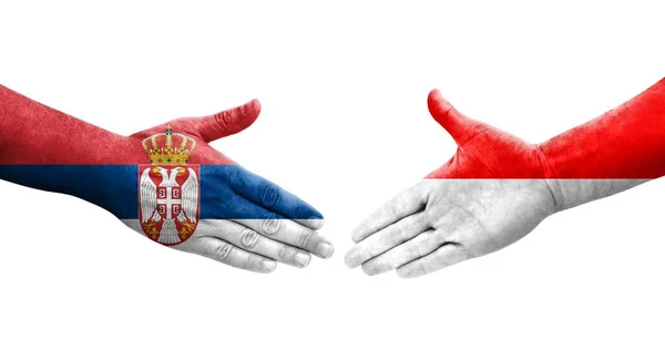印度尼西亚和塞尔维亚之间握手 手绘国旗 孤立透明的形象 — 图库照片