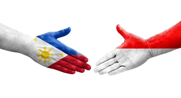 Uścisk Dłoni Między Indonezją Filipinami Flagi Malowane Rękach Odizolowany Przezroczysty — Zdjęcie stockowe