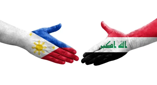 Handslag Mellan Irak Och Filippinerna Flaggor Målade Händer Isolerad Transparent — Stockfoto