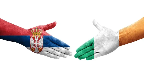 Χειραψία Μεταξύ Ιρλανδίας Και Σερβίας Σημαίες Ζωγραφισμένες Στα Χέρια Απομονωμένη — Φωτογραφία Αρχείου