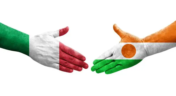 stock image Handshake between Italy and Niger flags painted on hands, isolated transparent image.