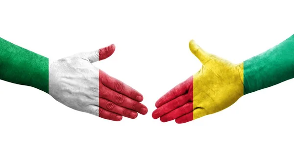 Handslag Mellan Italien Och Guinea Flaggor Målade Händer Isolerad Transparent — Stockfoto