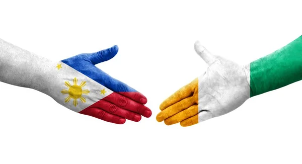 Handslag Mellan Elfenbenskusten Och Filippinerna Flaggor Målade Händer Isolerad Transparent — Stockfoto