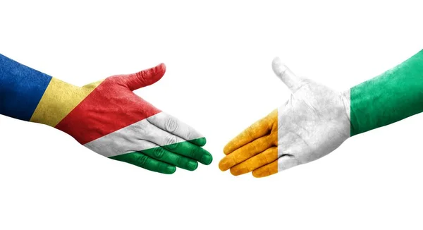 象牙海岸和塞舌尔国旗之间的握手 孤立透明的图像 — 图库照片