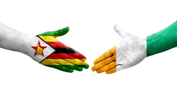Рукостискання Між Берегом Слонової Кості Прапорами Зімбабве Намальовані Руках Ізольоване — стокове фото