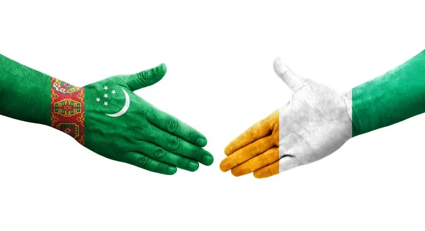 Händedruck Zwischen Der Elfenbeinküste Und Turkmenistan Flaggen Auf Hände Gemalt — Stockfoto