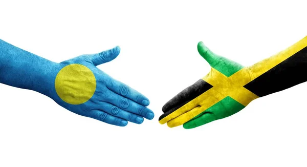 Ellerinde Jamaika Palau Bayrakları Arasında Sıkışma Izole Şeffaf Görüntü — Stok fotoğraf