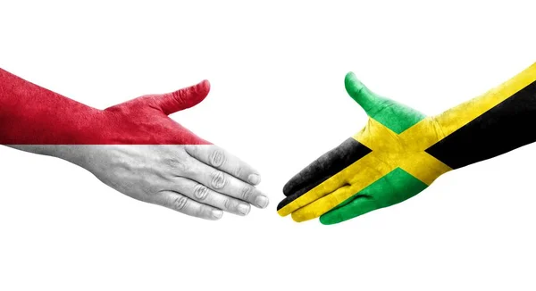 Apretón Manos Entre Jamaica Mónaco Banderas Pintadas Las Manos Imagen —  Fotos de Stock
