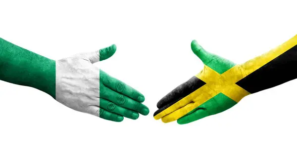 Ellerinde Jamaika Nijerya Bayrakları Arasında Sıkışma Izole Şeffaf Görüntü — Stok fotoğraf