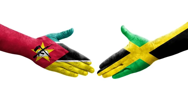 Apretón Manos Entre Jamaica Mozambique Banderas Pintadas Las Manos Imagen — Foto de Stock