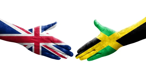 Handdruk Tussen Jamaica Het Verenigd Koninkrijk Vlaggen Geschilderd Handen Geïsoleerd — Stockfoto