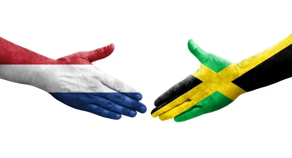 Ellerinde Jamaika Hollanda Bayrakları Arasında Sıkışma Izole Şeffaf Görüntü — Stok fotoğraf