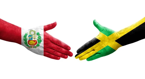 手に描かれたジャマイカとペルーの旗の間の握手 孤立した透明なイメージ — ストック写真