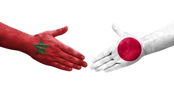 Händedruck Zwischen Japanischen Und Marokkanischen Flaggen Auf Hände Gemalt Isoliertes — Stockfoto