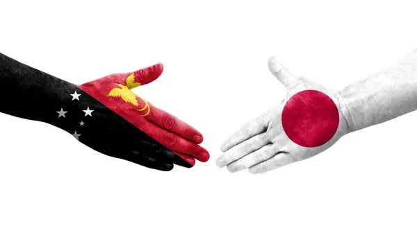 Handslag Mellan Japan Och Papua Nya Guinea Flaggor Målade Händer — Stockfoto