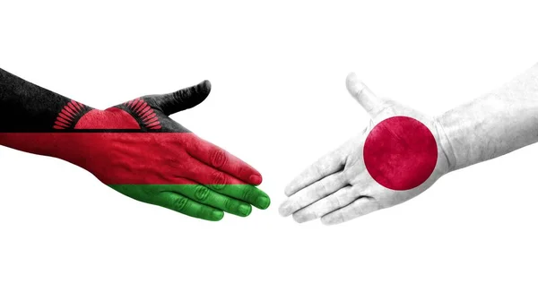Uścisk Dłoni Między Japonią Malawi Flagi Malowane Rękach Odizolowany Przezroczysty — Zdjęcie stockowe