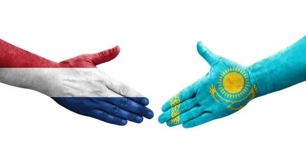 Рукостискання Між Казахстаном Голландією Прапори Намальовані Руках Ізольоване Прозоре Зображення — стокове фото