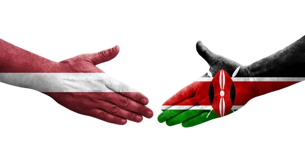 Serrer Main Entre Kenya Lettonie Drapeaux Peints Sur Les Mains — Photo
