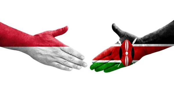 肯尼亚和摩纳哥之间的握手 手绘国旗 孤立透明的形象 — 图库照片