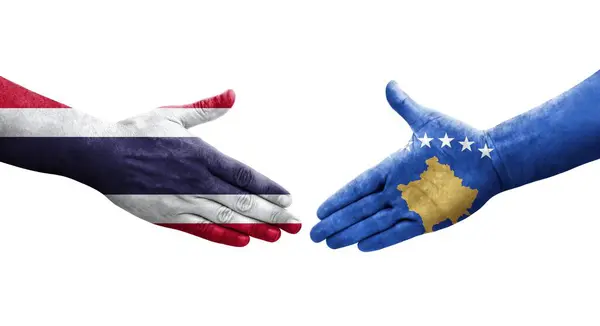 stock image Handshake between Kosovo and Thailand flags painted on hands, isolated transparent image.