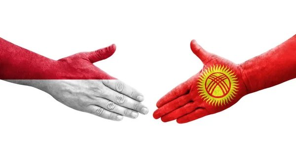 Handdruk Tussen Kirgizië Monaco Vlaggen Geschilderd Handen Geïsoleerd Transparant Beeld — Stockfoto