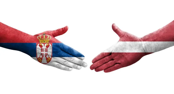 Mano Apretada Entre Letonia Serbia Banderas Pintadas Las Manos Imagen — Foto de Stock